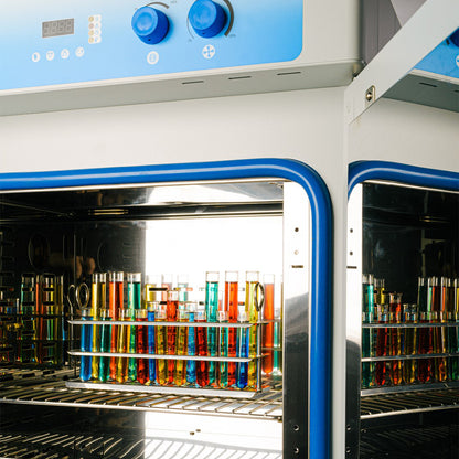 Incubator with colorful test tubes inside