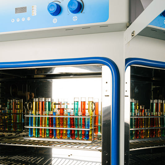 Incubator with colorful test tubes inside