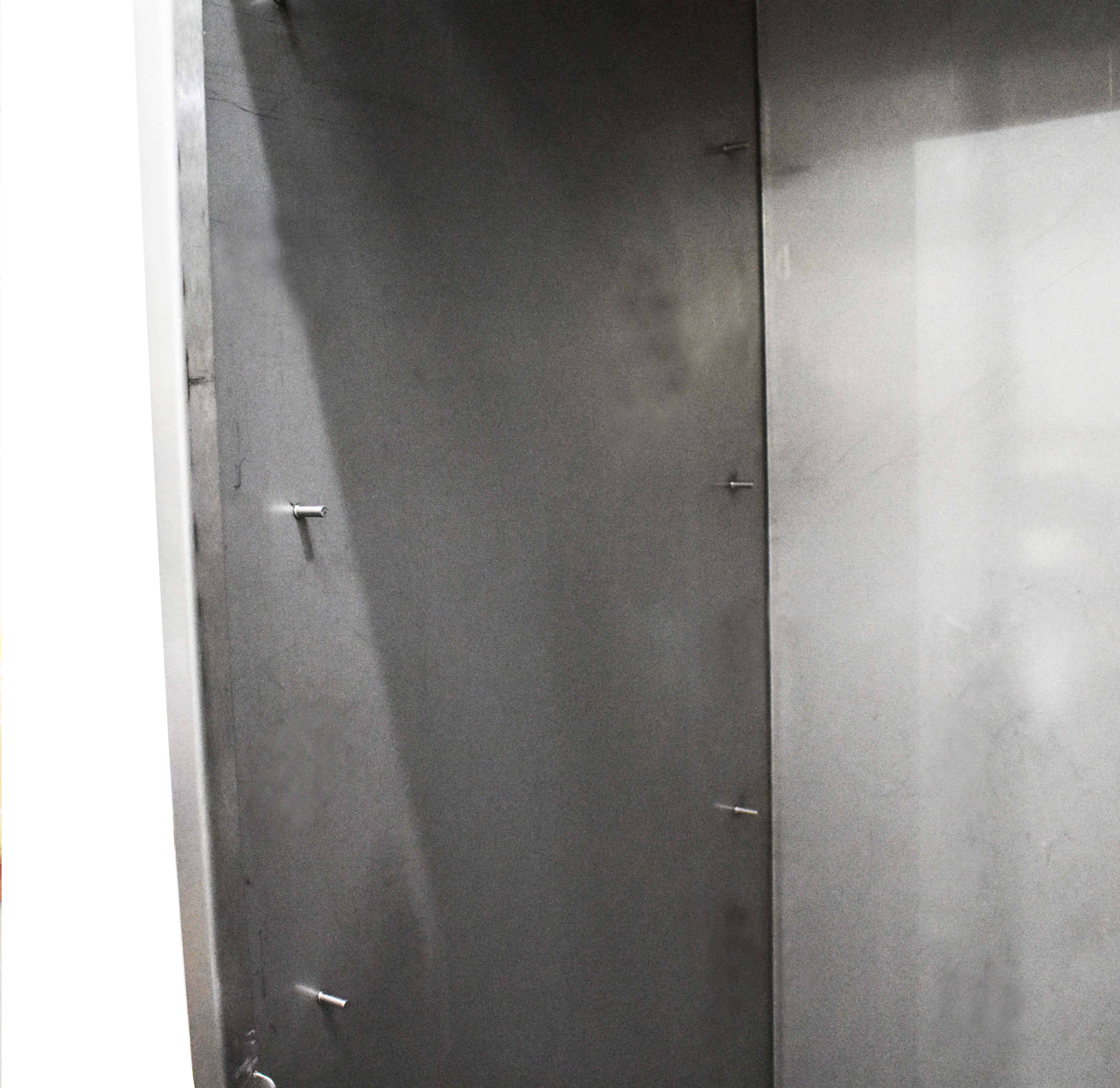 Stainless steel cupboard with garment rail
